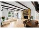 Living room with hardwood floors and stone fireplace at 4403 Pike Ave, Sarasota, FL 34233