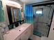 Updated bathroom with a walk-in shower and a modern vanity at 5021 Pebble Beach Ave, Sarasota, FL 34234