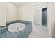 Large bathroom with soaking tub and walk-in shower at 526 N Spoonbill Dr, Sarasota, FL 34236