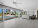 Bright Gathering room with view of pool and canal from sliding doors at 526 N Spoonbill Dr, Sarasota, FL 34236