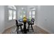 Small breakfast nook with a round table and white shutters at 5835 Los Verdes Ct, Bradenton, FL 34210