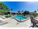 Community pool with lounge chairs at 6309 Manatee W Ave # 6309, Bradenton, FL 34209