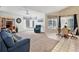 Relaxing living room with bay window, recliner, and neutral carpeting at 806 Mcarthur Ave, Sarasota, FL 34243