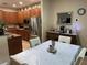Kitchen boasts stainless steel appliances and wood cabinets at 2271 50Th Street E Cir, Palmetto, FL 34221
