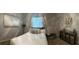 Bright bedroom with light walls and a queen-size bed, with unique storage at 2271 50Th Street E Cir, Palmetto, FL 34221