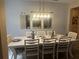 Light and bright dining room ready for entertaining with seating for eight at 2271 50Th Street E Cir, Palmetto, FL 34221