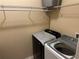 Convenient laundry room with washer, dryer and shelving at 2271 50Th Street E Cir, Palmetto, FL 34221