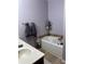 Relaxing bathroom with double vanity, soaking tub, and tiled floors at 2271 50Th Street E Cir, Palmetto, FL 34221
