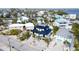 Bird's-eye view of the home showcasing its unique design among other houses at 243 S Harbor Dr, Holmes Beach, FL 34217
