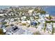 Aerial showing location of house in relation to neighboring houses and water at 243 S Harbor Dr, Holmes Beach, FL 34217