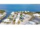 Aerial view of waterfront home with private dock and stunning water views at 243 S Harbor Dr, Holmes Beach, FL 34217