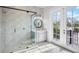 Modern bathroom with a glass shower and patterned wall at 243 S Harbor Dr, Holmes Beach, FL 34217