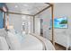 Main bedroom with a large four-poster bed and TV at 243 S Harbor Dr, Holmes Beach, FL 34217
