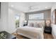 Serene bedroom with coastal decor and private balcony access at 243 S Harbor Dr, Holmes Beach, FL 34217