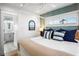 Main bedroom with ensuite bathroom and coastal decor at 243 S Harbor Dr, Holmes Beach, FL 34217