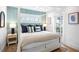 Bedroom with a canopy bed and access to a balcony at 243 S Harbor Dr, Holmes Beach, FL 34217