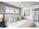 Main bedroom with ensuite bathroom and coastal decor at 243 S Harbor Dr, Holmes Beach, FL 34217