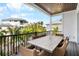 Outdoor patio with table and chairs, offering scenic views at 243 S Harbor Dr, Holmes Beach, FL 34217