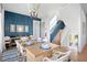 Bright dining room with a large wooden table and blue and white accents at 243 S Harbor Dr, Holmes Beach, FL 34217