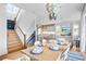 Bright dining room with a large table, and access to kitchen and living areas at 243 S Harbor Dr, Holmes Beach, FL 34217
