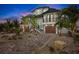 Stunning two-story home with a dark roof, and a well manicured front yard at 243 S Harbor Dr, Holmes Beach, FL 34217
