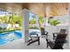 Relaxing pool area with patio furniture and a tiled pool at 243 S Harbor Dr, Holmes Beach, FL 34217