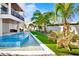 Relaxing pool area with lush landscaping and comfortable seating at 243 S Harbor Dr, Holmes Beach, FL 34217