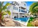 Inviting backyard oasis with a sparkling pool and spa at 243 S Harbor Dr, Holmes Beach, FL 34217