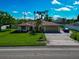 Single-Gathering home with a two-car garage and lush lawn at 3363 Shamrock Dr, Venice, FL 34293