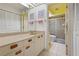 Bathroom with a shower, and a large vanity area, and neutral tones at 3375 Sandleheath # 34, Sarasota, FL 34235