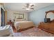 Inviting bedroom with a ceiling fan, neutral tones, and a view of the outdoors at 3375 Sandleheath # 34, Sarasota, FL 34235