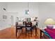 Inviting dining area featuring hardwood floors and an open layout at 3375 Sandleheath # 34, Sarasota, FL 34235