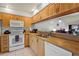 Well-lit kitchen features ample cabinet space and modern appliances at 3375 Sandleheath # 34, Sarasota, FL 34235