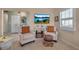 Cozy sitting area with two armchairs and a decorative ottoman at 3410 Avenida Madera # B, Bradenton, FL 34210