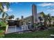 Home's exterior showcasing a deck and screened enclosure at 3410 Avenida Madera # B, Bradenton, FL 34210