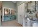 Bright entryway with decorative accents and a charming bench at 3410 Avenida Madera # B, Bradenton, FL 34210