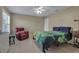 Bedroom with a relaxing atmosphere, featuring a bed and a comfortable chair at 3410 Avenida Madera # B, Bradenton, FL 34210