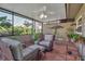 Relaxing screened porch with wicker furniture and terracotta tile floor at 3410 Avenida Madera # B, Bradenton, FL 34210