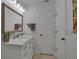 Clean bathroom, featuring a vanity with drawers and a large mirror at 3410 Avenida Madera # B, Bradenton, FL 34210