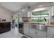 Modern kitchen featuring stainless steel appliances and granite countertops at 3410 Avenida Madera # B, Bradenton, FL 34210