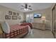 Cozy bedroom with a full-size bed, dresser, and window seating at 3410 Avenida Madera # B, Bradenton, FL 34210