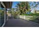Deck with white railings and view of a lush green backyard at 3410 Avenida Madera # B, Bradenton, FL 34210