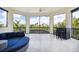 Spacious screened balcony with outdoor furniture and scenic view at 4011 5Th Ne Ave, Bradenton, FL 34208