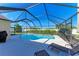 Inviting screened-in pool with lounge chairs at 4135 Dover E Dr, Bradenton, FL 34203