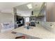 Modern kitchen boasts granite countertops, dark wood cabinets and stainless steel appliances at 4135 Dover E Dr, Bradenton, FL 34203