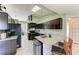 Well-equipped kitchen featuring a central island with granite countertops and ample cabinetry at 4135 Dover E Dr, Bradenton, FL 34203