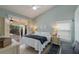 Relaxing main bedroom with access to the patio, light blue walls, and neutral decor at 4135 Dover E Dr, Bradenton, FL 34203