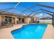 Beautiful screened-in pool with blue water and a spacious deck, ideal for enjoying sunny days at 4135 Dover E Dr, Bradenton, FL 34203