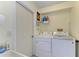 Bright laundry room with washer, dryer, and utility sink at 4135 Dover E Dr, Bradenton, FL 34203