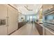 Modern kitchen with stainless steel appliances and light wood cabinets at 535 Sanctuary Dr # C807, Longboat Key, FL 34228